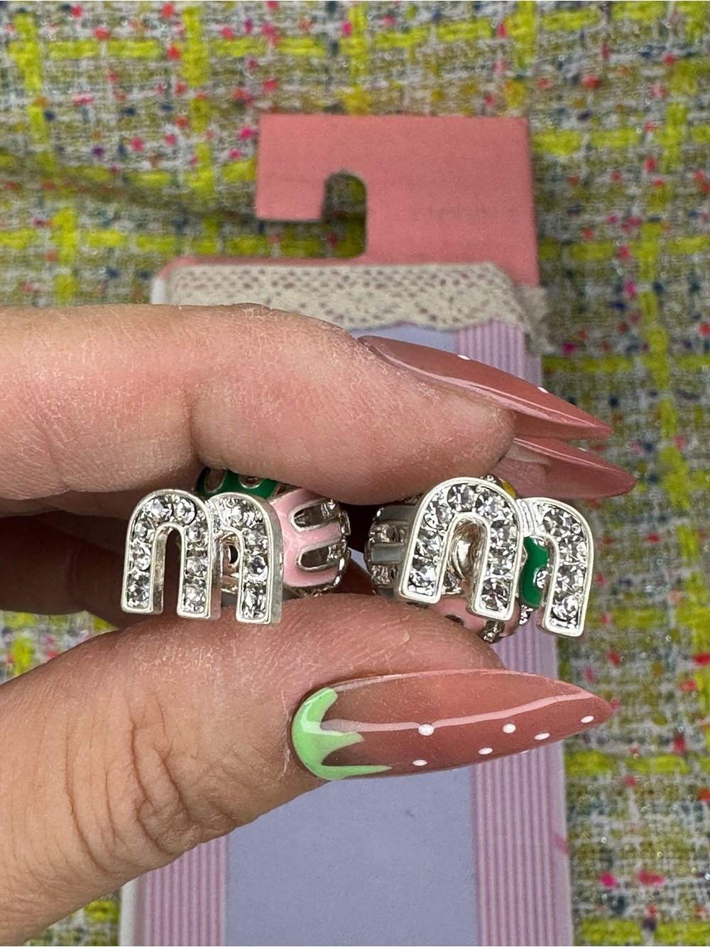 A great Crystal-Encrusted 'M' Stud Earrings in Pink and Green - Designer Style